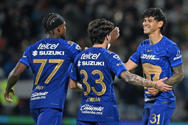 Pumas' Paraguayan forward #31 Robert Morales (R) celebrates with teammates after scoring his team's second goal during the Liga MX Clausura match between Pumas and Toluca at Olimpico Universitario Stadium in Mexico City on March 3, 2026. (Photo by Carl DE SOUZA / AFP)
