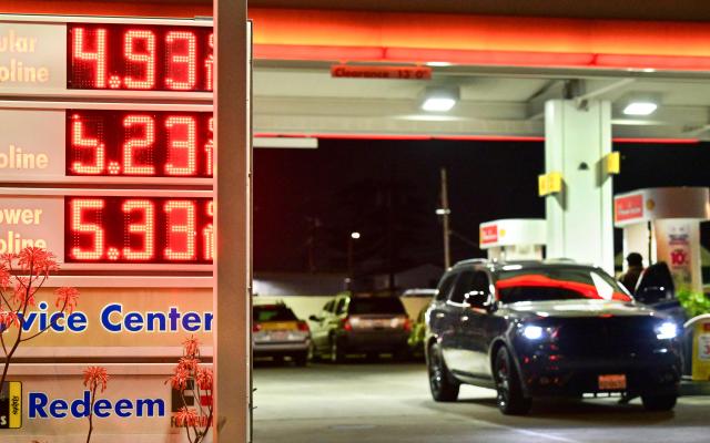 A sign with current gas prices is displayed at a gas station in Monterey Park, California on March 3, 2026. Energy prices surged on March 2 as the war in the Middle East led to outages of key energy production operations. In parallel, energy markets are also absorbing a de facto halt to traffic in the Strait of Hormuz, through which about 20 percent of global supply of oil and liquid natural gas travel. (Photo by Frederic J. BROWN / AFP)