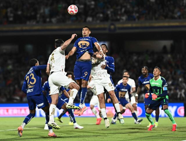 Pumas' forward #09 Guillermo Martinez jumps to head the ball during the Liga MX Clausura match between Pumas and Toluca at Olimpico Universitario Stadium in Mexico City on March 3, 2026. (Photo by Carl DE SOUZA / AFP)
