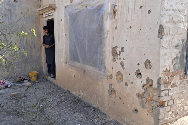 This picture taken on March 3, 2026 shows a resident looking at his damaged home in Landi Kotal near the Torkham border between Afghanistan and Pakistan, amid the ongoing clashes between the two countries. (Photo by Basit SHAH / AFP)