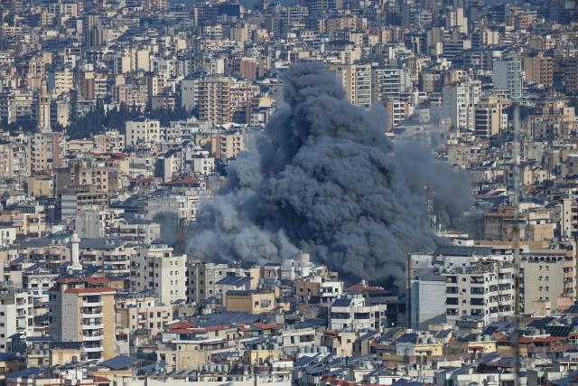 A plume of smoke rises from the site of an Israeli airstrike in the southern suburbs of Beirut's Haret Hreik neighborhood on March 4, 2026. Israel launched fresh strikes on Iran and Lebanon, where state media reported a residential building was hit on March 4, as Iran's Guards said they had sealed off one of the world's most vital shipping routes for energy. (Photo by IBRAHIM AMRO / AFP)