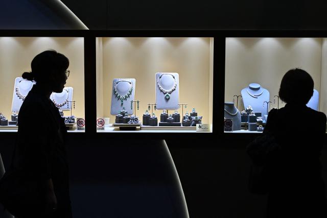 Visitors attend the Hong Kong International Jewellery Fair at the Convention Centre in Hong Kong on March 4, 2026. (Photo by Peter PARKS / AFP)
