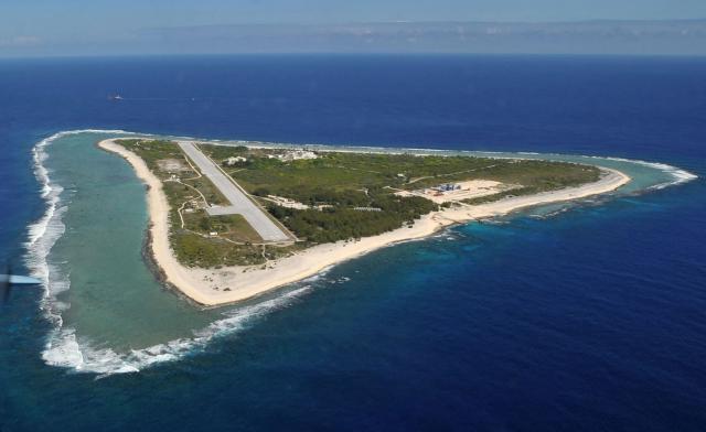 This photo taken on November 21, 2012 shows an aerial view of Minamitorishima Island in Ogasawara Village, Tokyo Prefecture, where the government requested a literature survey regarding the selection of a final disposal site for high-level radioactive waste from nuclear power plants. Japan is looking into using a remote deserted Pacific island nearly 2,000 kilometres (1,250 miles) from Tokyo as a site for burying nuclear waste, officials said on March 4, 2026. (Photo by JIJI PRESS / AFP) / Japan OUT