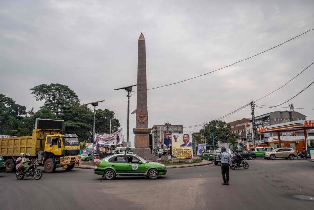 A policeman directs traffic in Brazzaville on March 3, 2026, ahead of the country's March 15 presidential election. Congo-Brazzaville, a former French colony which gained independence in 1960, is rich in oil but nearly half of its six million people live below the poverty line. (Photo by Glody MURHABAZI / AFP)