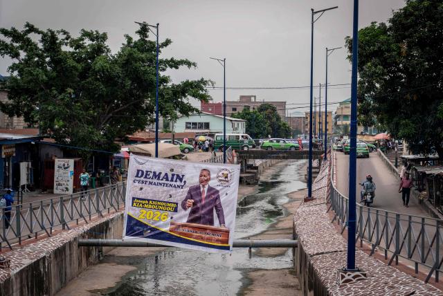 A general view of an electoral poster in Brazzaville on March 3, 2026, ahead of the country's March 15 presidential election. Congo-Brazzaville, a former French colony which gained independence in 1960, is rich in oil but nearly half of its six million people live below the poverty line. (Photo by Glody MURHABAZI / AFP)