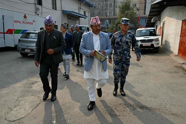 Chief Election Commissioner Ram Prasad Bhandari arrives to address a press conference in Kathmandu on March 4, 2026 on the eve of Nepal’s parliamentary elections. Nepal set up polling centres on March 4 for one of its most hotly contested elections since the end of civil war in 2006, six months after deadly anti-corruption protests toppled the government. (Photo by TAUSEEF MUSTAFA / AFP)