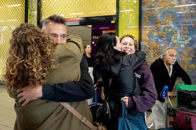 Travelers arrive at the Amsterdam Airport Schiphol after returning from the Middle East, in Haarlemmermeer on March 4, 2026, after many flights were cancelled after Iran began striking targets in the Gulf, including the cities' airports. (Photo by Ramon van Flymen / ANP / AFP) / Netherlands OUT