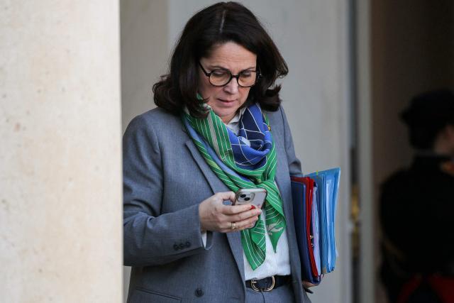 France's Sports Minister Marina Ferrari looks at her phone as she leaves after the weekly cabinet meeting at The Elysee Presidential Palace in Paris on March 4, 2026. (Photo by Thomas SAMSON / AFP)
