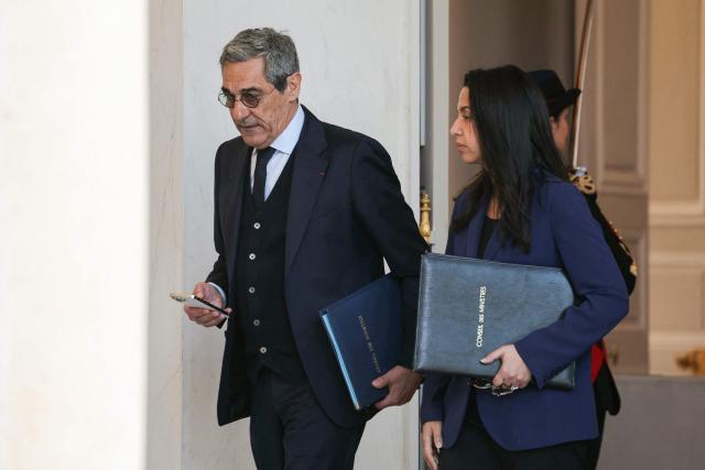 France's Trade Minister Serge Papin (L) and France's Overseas Minister Naima Moutchou leave after the weekly cabinet meeting at The Elysee Presidential Palace in Paris on March 4, 2026. (Photo by Thomas SAMSON / AFP)