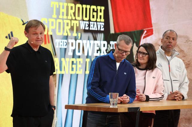 (L-R) Bjoern Gulden, Chief Executive Officer of German sportswear giant Adidas, Harm Ohlmeyer, Chief Financial Officer, Michelle Robertson, Global Human Resources, and Mathieu Sidokpohou, Sales Director, attend the company's annual press conference in Herzogenaurach, southern Germany, on March 4, 2026. Adidas shares slumped after the company gave a disappointing 2026 profit forecast and warned of a 400-million-euro ($465-million) hit from US tariffs and exchange rate effects. The maker of Gazelle and Samba trainers said it expects operating profit to rise to 2.3 billion euros for 2026, as it unveiled its annual results. The group's shares fell about eight percent on the Frankfurt Stock Exchange after the announcement, and were trading around 137 euros each. (Photo by Karl-Josef Hildenbrand / AFP)