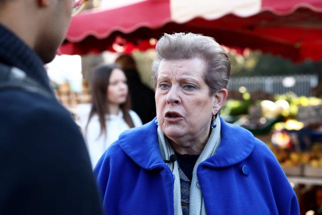 Socialist Party (PS)'s Strasbourg mayoral candidate Catherine Trautmann reacts as she meets with local resident during her visit to a local market ahead of France's upcoming municipal elections in Strasbourg, eastern France on March 4, 2026. (Photo by FREDERICK FLORIN / AFP)