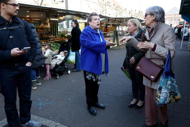 Socialist Party (PS)'s Strasbourg mayoral candidate Catherine Trautmann reacts as she meets with local resident during her visit to a local market ahead of France's upcoming municipal elections in Strasbourg, eastern France on March 4, 2026. (Photo by FREDERICK FLORIN / AFP)