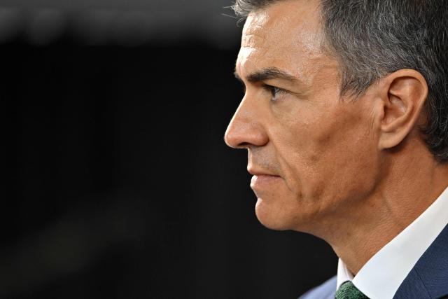 (FILES) Spanish Prime Minister Pedro Sanchez looks on after a meeting with Uruguay's President Yamandu Orsi at the Torre Ejecutiva (Executive Tower), the government's headquarters, in Montevideo on July 22, 2025. Spanish PM Pedro Sanchez hit back today at US President Donald Trump's criticisms of Madrid's refusal to let US planes use its bases to attack Iran, saying "no to war". (Photo by Santiago Mazzarovich / AFP)