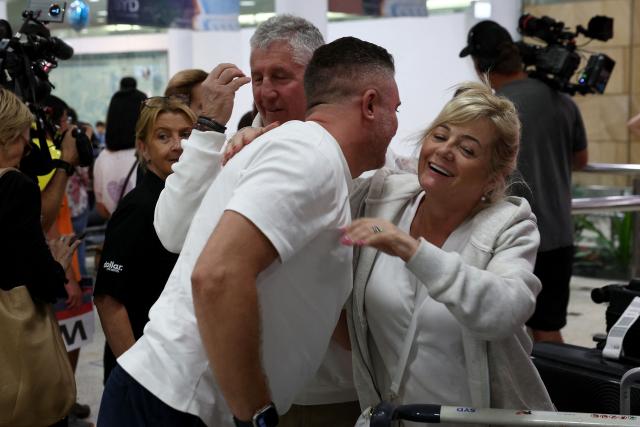 Passengers arrive from a Dubai flight at Sydney Kingsford Smith International Airport on March 4, 2026. Thousands of flights have been delayed or cancelled in the biggest disruption to global air transport since the Covid pandemic as airlines suspend services to the Middle East following the US and Israeli attacks on Iran. (Photo by Izhar KHAN / AFP)