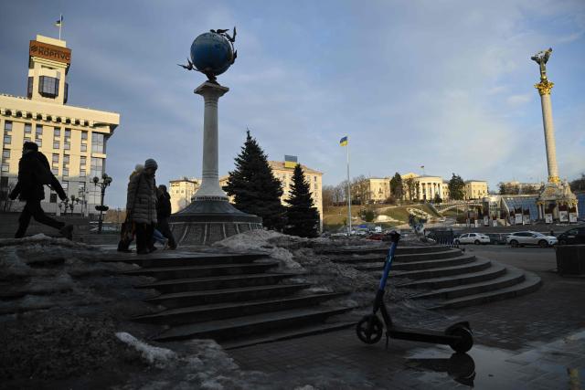 People walk through Independence Square in Kyiv on March 4, 2026, amid the Russian invasion of Ukraine. (Photo by Genya SAVILOV / AFP)