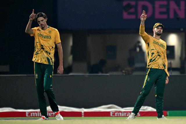 South Africa's captain Aiden Markram (R) and Marco Jansen gesture during the 2026 ICC Men's T20 Cricket World Cup semi-final match between New Zealand and South Africa at the Eden Gardens in Kolkata on March 4, 2026. (Photo by Arun SANKAR / AFP)