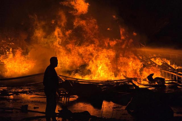 Civil defence forces attempt to extinguish a blaze that erupted after Israeli bombardment on a solar farm and electricity generation facility in Lebanon's southern coastal city of Tyre on March 4, 2026. Israeli forces on March 4 advanced into a number of towns and villages in south Lebanon, a source from the UN peacekeeping force in the country, UNIFIL, told AFP. (Photo by KAWANT HAJU / AFP)