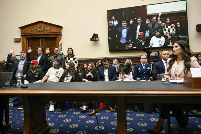 American citizens who've been detained by ICE stand as they are recognized by US Representative Pramila Jayapal (out of frame), Democrat from Washington, as Secretary of Homeland Security Kristi Noem (R) testifies during a House Judiciary Committee hearing on oversight of the Department of Homeland Security on Capitol Hill in Washington, DC, on March 4, 2026. (Photo by Brendan SMIALOWSKI / AFP)