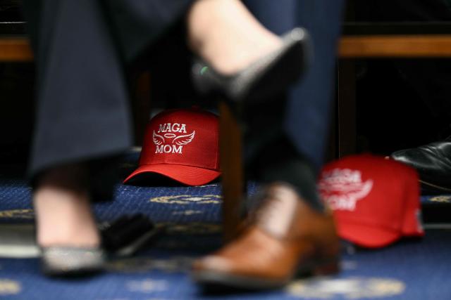 A hat reading "MAGA Mom" sits on the floor as US Secretary of Homeland Security Kristi Noem testifies during a House Judiciary Committee hearing on oversight of the Department of Homeland Security on Capitol Hill in Washington, DC, on March 4, 2026. (Photo by Brendan SMIALOWSKI / AFP)