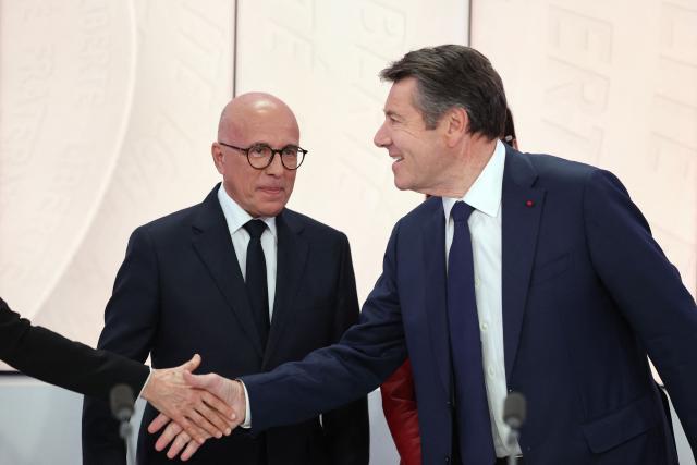 President of Union des Droites pour la Republique (UDR) parliamentary group president and Nice mayoral candidate Eric Ciotti (L) stands next to French mayor of Nice and candidate for Horizons and Les Republicans for his reelection Christian Estrosi(R) shaking hands ahead of a debate broadcasted by French TV channel France TV/LCI Provence-Alpes-Côte-d'Azur between the main candidates for France's upcoming municipal elections in Nice, southeastern France on March 4, 2026. French voters head to the polls for municipal elections on March 15 and 22, 2026. (Photo by Valery HACHE / AFP)