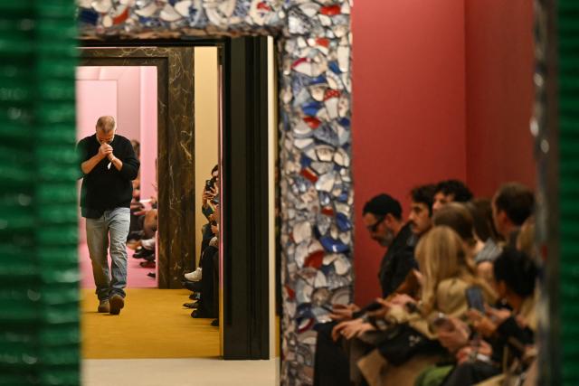 Sweden fashion designer Jonny Johansson acknowledges the audience at the end of the Acne Studios Women's Ready to Wear Fall/Winter 2026-2027 collection fashion show as part of the Paris Women Fashion Week, in Paris, on March 4, 2026. (Photo by Julie SEBADELHA / AFP)