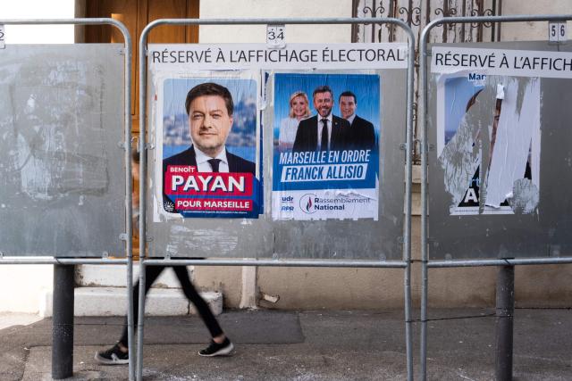 A photo shows campaign posters of Marseille mayoral candidates, incumbent mayor Benoit Payan for the left-wing coalition Printemps Marseillais (L) and Franck Allisio of the far-right Rassemblement National (RN) party, ahead of France's municipal elections in Marseille, southeastern France, on March 4, 2026. French voters head to the polls for municipal elections on March 15 and 22, 2026. (Photo by Elodie CLEMENT / AFP)