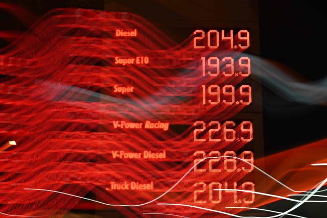 A photo shows an illuminated display showing the prices at a gas station in Bochum on March 4, 2026. Oil prices are expected to continue to rise after traffic through the Strait of Hormuz has almost entirely halted following Iran's threat to attack ships that would try to sail through. (Photo by Ina FASSBENDER / AFP)