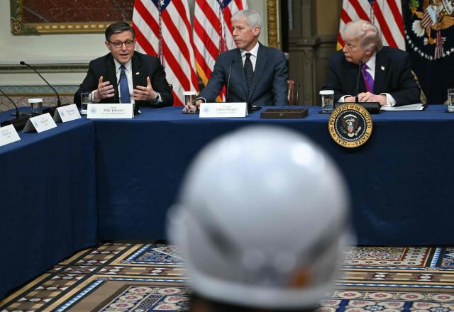 US President Donald Trump (R) and Energy Secretary Chris Wright (C) listen to House Speaker Mike Johnson (L) during a roundtable on Ratepayer Protection Pledge in the Indian Treaty Room at the Eisenhower Executive Office Building on the White House campus in Washington, DC, on March 4, 2026. (Photo by ANDREW CABALLERO-REYNOLDS / AFP)