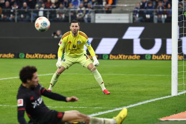 Hamburg's Portuguese goalkeeper #01 Daniel Fernandes keeps his eye on the ball during the German first division Bundesliga football match between Hamburger SV and Bayer 04 Leverkusen in Hamburg, northern Germany on March 4, 2026. (Photo by IBRAHIM OT / AFP) / DFL REGULATIONS PROHIBIT ANY USE OF PHOTOGRAPHS AS IMAGE SEQUENCES AND/OR QUASI-VIDEO