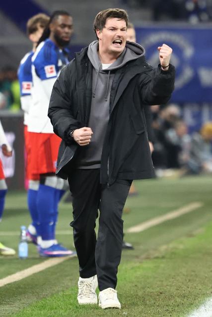 Hamburg's German head coach Merlin Polzin reacts from the sidelines during the German first division Bundesliga football match between Hamburger SV and Bayer 04 Leverkusen in Hamburg, northern Germany on March 4, 2026. (Photo by IBRAHIM OT / AFP) / DFL REGULATIONS PROHIBIT ANY USE OF PHOTOGRAPHS AS IMAGE SEQUENCES AND/OR QUASI-VIDEO