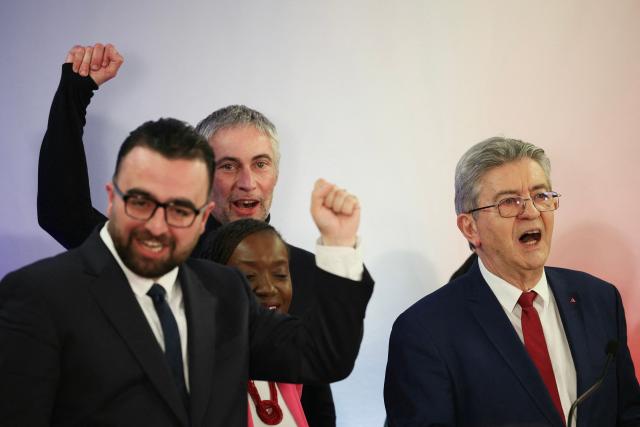 La France Insoumise - Nouveau Front Populaire's MP Jerome Legavre (2ndL) and leader of French left-wing La France Insoumise (LFI) party Jean-Luc Melenchon sing France's national anthem at a campaign rally to support Bondy's LFI mayoral candidate Mehmet Ozguner (L),  ahead of France's upcoming municipal elections in Bondy in Seine-Saint-Denis on March 4, 2026. French voters head to the polls for municipal elections on March 15 and 22, 2026. (Photo by Dimitar DILKOFF / AFP)