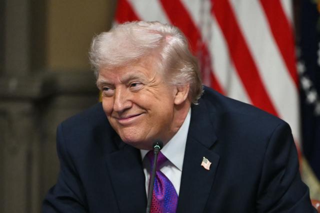 US President Donald Trump smiless during a roundtable on Ratepayer Protection Pledge in the Indian Treaty Room at the Eisenhower Executive Office Building on the White House campus in Washington, DC, on March 4, 2026. (Photo by ANDREW CABALLERO-REYNOLDS / AFP)