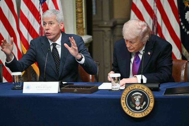 US President Donald Trump signs a proclamation as Energy Secretary Chris Wright (L) speaks during a roundtable on Ratepayer Protection Pledge in the Indian Treaty Room at the Eisenhower Executive Office Building on the White House campus in Washington, DC, on March 4, 2026. (Photo by ANDREW CABALLERO-REYNOLDS / AFP)
