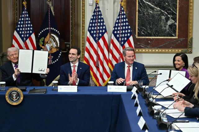 US President Donald Trump shows a proclamation he signed during a roundtable on Ratepayer Protection Pledge in the Indian Treaty Room at the Eisenhower Executive Office Building on the White House campus in Washington, DC, on March 4, 2026. (Photo by ANDREW CABALLERO-REYNOLDS / AFP)