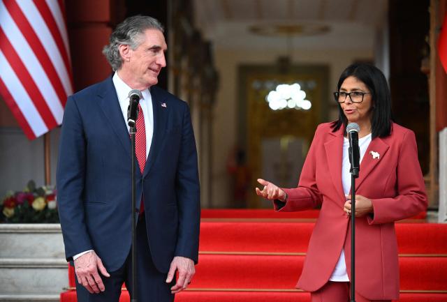 Venezuela’s interim president, Delcy Rodriguez speaks alongside US Interior Secretary Doug Burgum, after their meeting at the Miraflores Presidential Palace in Caracas on March 4, 2026. US Interior Secretary Doug Burgum on March 4, 2026,  became the latest senior Trump administration official to visit Venezuela, as Washington pushes to ramp up oil and mineral production in the country. (Photo by Federico PARRA / AFP)