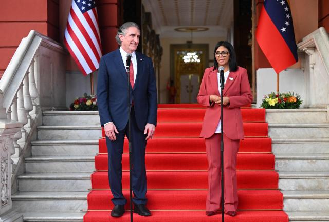 Venezuela’s interim president, Delcy Rodriguez speaks alongside US Interior Secretary Doug Burgum, after their meeting at the Miraflores Presidential Palace in Caracas on March 4, 2026. US Interior Secretary Doug Burgum on March 4, 2026,  became the latest senior Trump administration official to visit Venezuela, as Washington pushes to ramp up oil and mineral production in the country. (Photo by Federico PARRA / AFP)