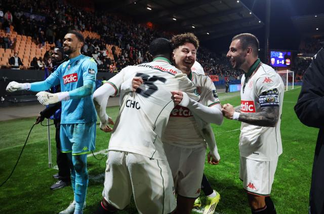 Nice's players celebrate their victory at the end of the French Cup quarter final football match between FC Lorient and OGC Nice at the Stade du Moustoir stadium in Lorient, western France on March 4, 2026. (Photo by Fred TANNEAU / AFP)