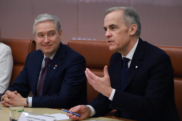 Canadian Prime Minister Mark Carney (R) holds talks with Australian Prime Minister Anthony Albanese at Parliament House in Canberra on March 5, 2026, as part of his official visit to Australia. (Photo by DAVID GRAY / AFP)