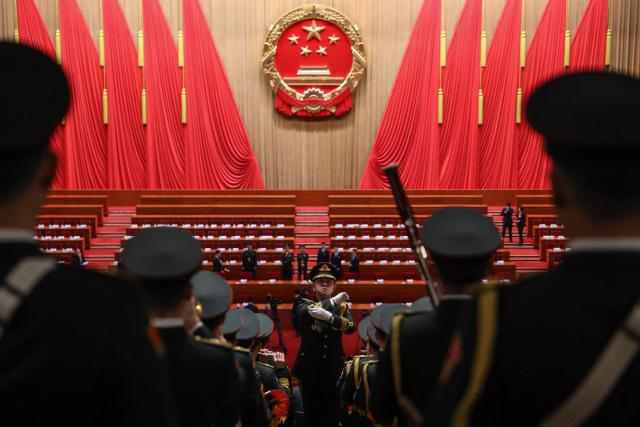 Military band members rehearse before the opening session of the National People's Congress (NPC) at the Great Hall of the People in Beijing on March 5, 2026. (Photo by Florence Lo / POOL / AFP)