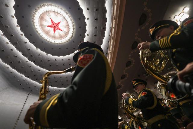 Military band members rehearse before the opening session of the National People's Congress (NPC) at the Great Hall of the People in Beijing on March 5, 2026. (Photo by Florence Lo / POOL / AFP)