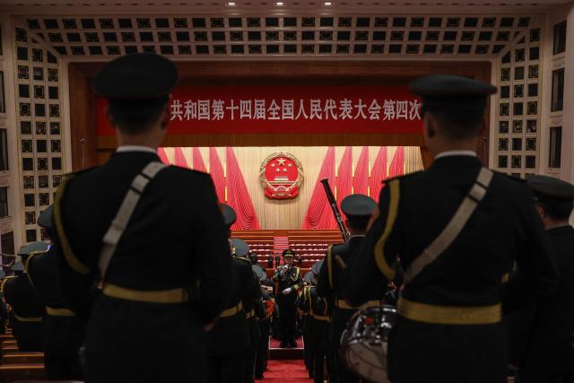 Military band members rehearse before the opening session of the National People's Congress (NPC) at the Great Hall of the People in Beijing on March 5, 2026. (Photo by Florence Lo / POOL / AFP)