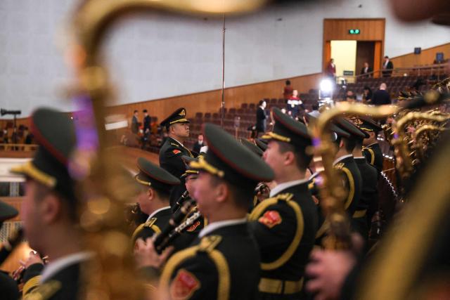 Military band members rehearse before the opening session of the National People's Congress (NPC) at the Great Hall of the People in Beijing on March 5, 2026. (Photo by Florence Lo / POOL / AFP)