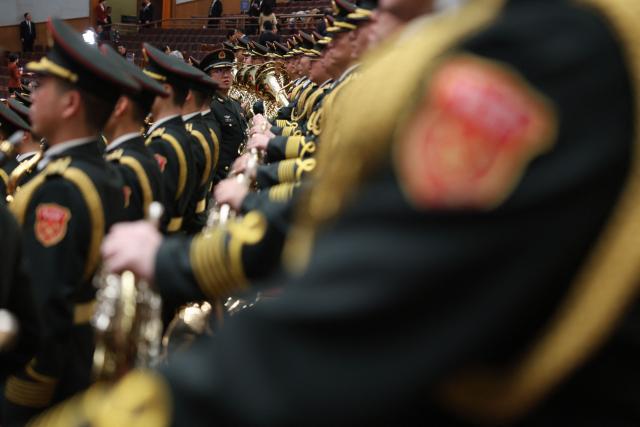 Military band members rehearse before the opening session of the National People's Congress (NPC) at the Great Hall of the People in Beijing on March 5, 2026. (Photo by Florence Lo / POOL / AFP)