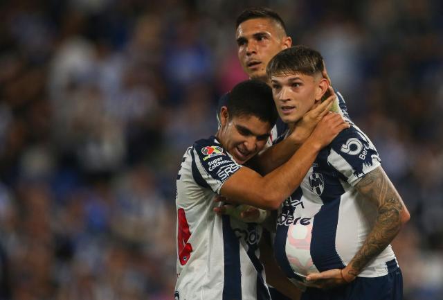 Monterrey's Argentine forward #11 Luca Orellano (R) celebrates with teammates defender #194 Christian Reyes (L) and Montenegrin forward #20 Uros Djurdevic after scoring his team's first goal during the Liga MX Clausura match between Monterrey and Queretaro at BBVA Stadium at Monterrey, Mexico, on March 4, 2026. (Photo by Julio Cesar AGUILAR / AFP)