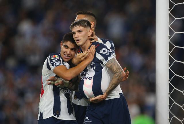 Monterrey's Argentine forward #11 Luca Orellano (R) celebrates with teammate defender #194 Christian Reyes after scoring his team's first goal during the Liga MX Clausura match between Monterrey and Queretaro at BBVA Stadium at Monterrey, Mexico, on March 4, 2026. (Photo by Julio Cesar AGUILAR / AFP)