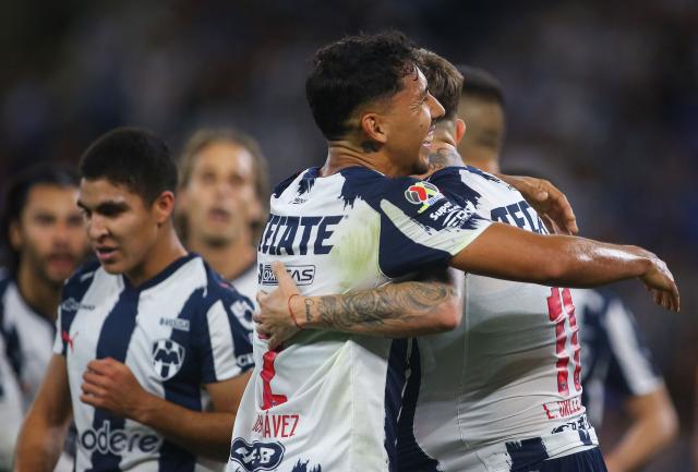 Monterrey's Argentine forward #11 Luca Orellano (R) celebrates with teammate defender #02 Ricardo Chavez after scoring his team's first goal during the Liga MX Clausura match between Monterrey and Queretaro at BBVA Stadium at Monterrey, Mexico, on March 4, 2026. (Photo by Julio Cesar AGUILAR / AFP)