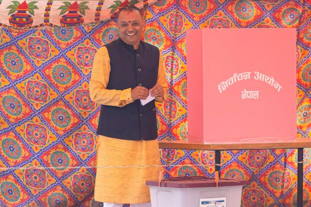 Nepali Congress party's president and candidate Gagan Thapa prepares to cast his ballot at a polling station during Nepal's parliamentary election in Kathmandu on March 5, 2026. Nepal voted on March 5 for a new parliament, six months after deadly anti-corruption protests toppled the government -- a high-stakes showdown between an entrenched old guard and a powerful youth movement. (Photo by PRABIN RANABHAT / AFP)