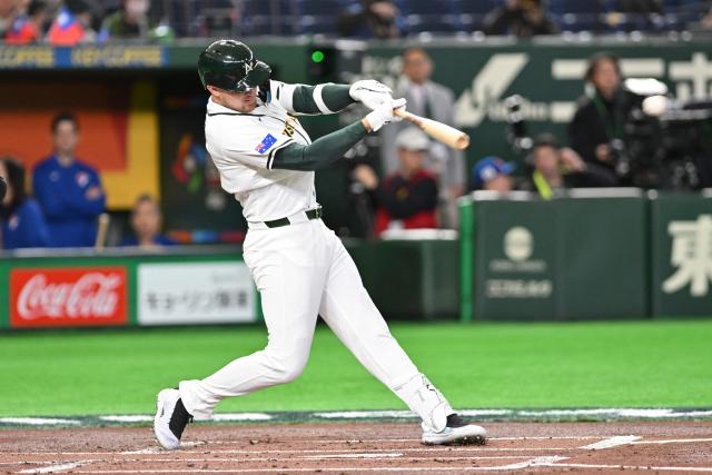 Australia's Curtis Mead hits a single at the World Baseball Classic (WBC) Pool C first round game between Australia and Taiwan at the Tokyo Dome on March 5, 2026. (Photo by Kazuhiro NOGI / AFP)