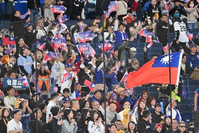 Taiwan supporters cheer during the World Baseball Classic (WBC) Pool C first round game between Australia and Taiwan at the Tokyo Dome on March 5, 2026. (Photo by Kazuhiro NOGI / AFP)