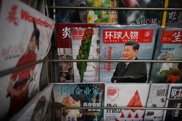 A magazine featuring a profile of Chinese President Xi Jinping is seen at a news stand on March 5, 2026, as the opening session of the National People’s Congress, the annual meeting of China’s legislature, was being held in Beijing. (Photo by GREG BAKER / AFP)